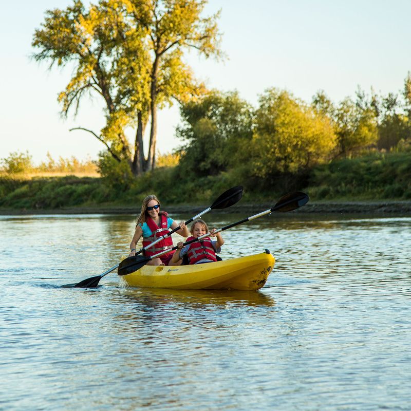 mother and daughter kayaking on the red river