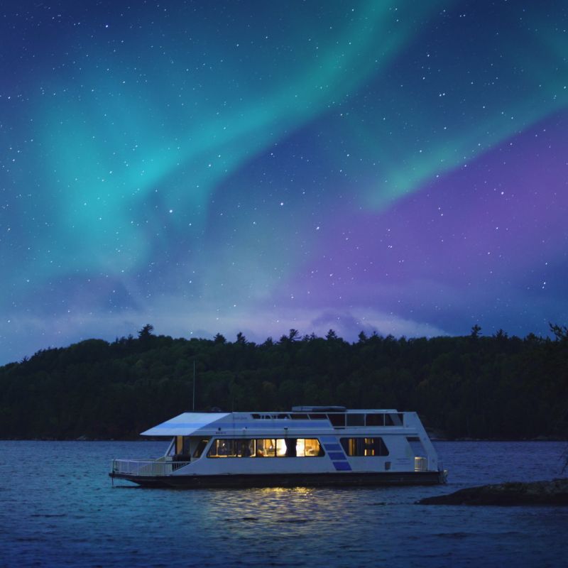 Northern lights over a houseboat in Voyageurs National Park