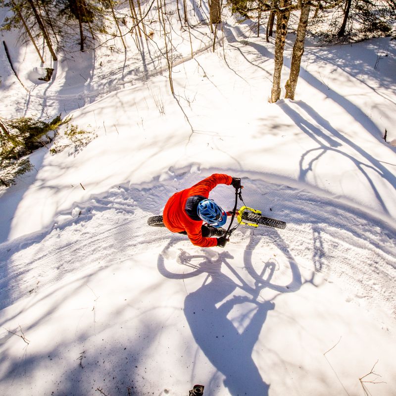 Winter fat biker going around a berm while riding in Duluth