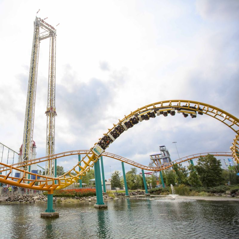 Riders do a 360-degree loop on the orange, Corkscrew roller coaster at Valleyfair
