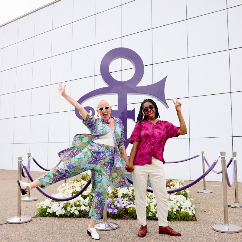 A couple poses outside Paisley Park